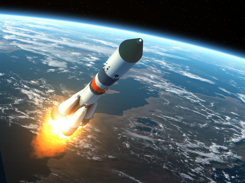 Image of launching rocket entering space.