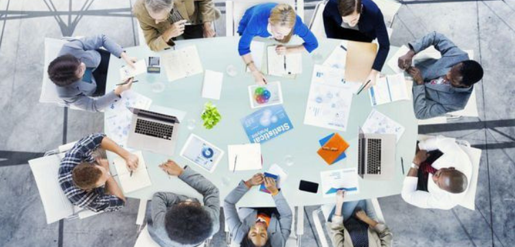 Ariel view of people sitting around conference table